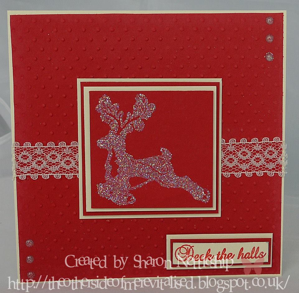 Red Christmas card with glitter reindeer