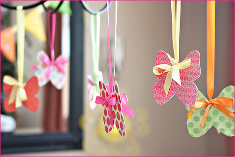 Paper butterflies hanging from ribbons